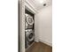 Laundry closet with a stacked washer and dryer at 1002 Forrest Blvd, Decatur, GA 30030