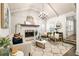 Cozy living room with vaulted ceiling, fireplace, and lots of natural light at 1002 Forrest Blvd, Decatur, GA 30030