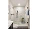 Contemporary bathroom with a frameless glass shower, patterned tile floor, and sleek fixtures at 1002 Forrest Blvd, Decatur, GA 30030