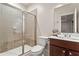 This bathroom has a glass enclosed shower with tile surround and a single sink vanity at 2482 Crescent Park Ct, Atlanta, GA 30339