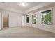 This bedroom has carpeted floors, tray ceilings and an access door to the exterior at 2482 Crescent Park Ct, Atlanta, GA 30339