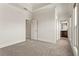 This bedroom features gray carpet, a tray ceiling and access to an en suite bathroom at 2482 Crescent Park Ct, Atlanta, GA 30339
