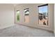 This bedroom has carpeted floors and three windows that provide natural light at 2482 Crescent Park Ct, Atlanta, GA 30339