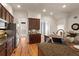 Kitchen features granite countertops, hardwood floors, stainless steel appliances, and ample cabinet space at 2482 Crescent Park Ct, Atlanta, GA 30339