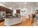 Modern kitchen with stainless steel appliances, granite countertops, a large island, and easy access to the living area at 2482 Crescent Park Ct, Atlanta, GA 30339