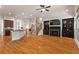 Open-concept living room features hardwood floors, fireplace, built-ins and seamless flow to the kitchen and staircase at 2482 Crescent Park Ct, Atlanta, GA 30339