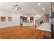 Hardwood floors meet the kitchen island and staircase in this open-concept living room with great natural light at 2482 Crescent Park Ct, Atlanta, GA 30339