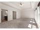 Large main bedroom with plush carpet, tray ceiling, and entry to main bath and walk-in closets at 2482 Crescent Park Ct, Atlanta, GA 30339