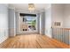 Sitting room boasts natural light, hardwood floors, and detailed trim work for a comfortable atmosphere at 2482 Crescent Park Ct, Atlanta, GA 30339