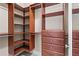 Walk-in closet with custom shelving and drawers to maximize storage at 2482 Crescent Park Ct, Atlanta, GA 30339