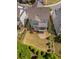 Aerial view of the property highlighting the well-manicured lawn, back patio, and surrounding landscaping at 3024 Eamont Ter, Atlanta, GA 30328