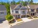 An elevated view showcasing the home's architectural design and well-manicured landscaping in a neighborhood at 3024 Eamont Ter, Atlanta, GA 30328