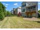 Large backyard with grass, landscaping, trees, and patio at 3024 Eamont Ter, Atlanta, GA 30328