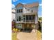 Aerial view of back of home featuring a screened in porch, patio, landscaping, and grass at 3024 Eamont Ter, Atlanta, GA 30328