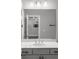 Bright bathroom featuring a white quartz vanity, modern faucet and fixtures, and neutral gray walls at 3024 Eamont Ter, Atlanta, GA 30328