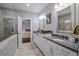 Well-lit bathroom with and sinks and access to the closet and main bedroom at 3024 Eamont Ter, Atlanta, GA 30328