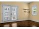 Bright bedroom with dark hardwood floors, balcony doors and natural light at 3024 Eamont Ter, Atlanta, GA 30328