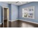 Cozy bedroom with hardwood floors, natural light, and a calming blue palette at 3024 Eamont Ter, Atlanta, GA 30328