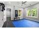 A bright exercise room with fitness equipment, large windows, and cushioned flooring at 3024 Eamont Ter, Atlanta, GA 30328