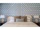 Close up of a main bedroom emphasizing the design of the accent wall behind the bed at 3024 Eamont Ter, Atlanta, GA 30328
