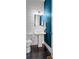 Elegant powder room with shiplap walls, pedestal sink, and decorative mirror at 3024 Eamont Ter, Atlanta, GA 30328