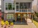 Exterior shot of a screened porch and patio area with brick supports and landscaping at 3024 Eamont Ter, Atlanta, GA 30328