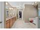Bathroom boasts tile flooring, a soaking tub, marble counters, cabinet storage and a walk-in shower at 3127 Lenox Ne Rd # 20, Atlanta, GA 30324