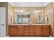 Large bathroom with a marble countertop, and sinks, a large mirror and cabinet storage at 3127 Lenox Ne Rd # 20, Atlanta, GA 30324