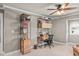 Bedroom with a ceiling fan, a desk and shelves, wood floors and a gray color scheme at 3127 Lenox Ne Rd # 20, Atlanta, GA 30324