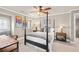 Bedroom featuring a ceiling fan, a four-poster bed, two bedside tables and neutral paint at 3127 Lenox Ne Rd # 20, Atlanta, GA 30324
