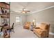 Bedroom with a ceiling fan, two chairs, a desk and bookshelf and a sitting area at 3127 Lenox Ne Rd # 20, Atlanta, GA 30324