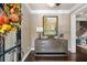 Stylish entryway with herringbone wallpaper, console table, and dark wood flooring at 3127 Lenox Ne Rd # 20, Atlanta, GA 30324