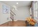 The living room showcases hardwood floors, a staircase, exposed brick, natural light, and neutral walls at 3127 Lenox Ne Rd # 20, Atlanta, GA 30324