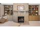 Relax in the living room next to a fireplace with built-in bookshelves on each side at 3127 Lenox Ne Rd # 20, Atlanta, GA 30324