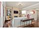 Open living space with a stone fireplace, built-in shelves, and hardwood floors at 3127 Lenox Ne Rd # 20, Atlanta, GA 30324
