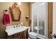 Chic powder room with decorative mirror, elegant vanity, and shuttered window at 3127 Lenox Ne Rd # 20, Atlanta, GA 30324