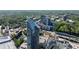 Captivating aerial view showcasing lush green landscapes, a sleek high-rise building, and a vibrant urban setting at 3338 Peachtree Ne Rd # 3102, Atlanta, GA 30326