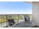 Balcony view with outdoor seating to enjoy the surrounding greenery and cityscape at 3338 Peachtree Ne Rd # 3102, Atlanta, GA 30326