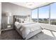 Bedroom featuring cityscape views from its large windows, complemented by a plush bed and stylish bedside tables at 3338 Peachtree Ne Rd # 3102, Atlanta, GA 30326