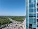 City view featuring a modern high-rise building, an outdoor balcony and views of the cityscape at 3338 Peachtree Ne Rd # 3102, Atlanta, GA 30326