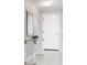 Elegant entryway with a mirrored wall, modern console table, and a crystal light fixture adding a touch of sophistication at 3338 Peachtree Ne Rd # 3102, Atlanta, GA 30326