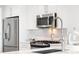 Modern kitchen with stainless steel appliances, sleek cabinets, and a stylish faucet at 3338 Peachtree Ne Rd # 3102, Atlanta, GA 30326