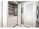 Laundry room with washer, dryer, storage shelves, and access to utilities at 3338 Peachtree Ne Rd # 3102, Atlanta, GA 30326