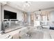 Modern living room featuring a mirrored cabinet, a glass table, and an open floor plan at 3338 Peachtree Ne Rd # 3102, Atlanta, GA 30326