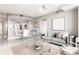 Stylish living room with contemporary furnishings, open to dining area, and plenty of natural light at 3338 Peachtree Ne Rd # 3102, Atlanta, GA 30326