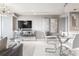 Open-concept living room with stylish decor, dining area, and sleek furniture at 3338 Peachtree Ne Rd # 3102, Atlanta, GA 30326