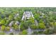 Aerial view of a tree-lined neighborhood showcasing the property's location amidst lush greenery and well-maintained streets at 5105 Chemin De Vie, Atlanta, GA 30342