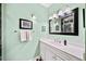 Modern bathroom featuring a white vanity, towel rack, and a framed mirror at 5105 Chemin De Vie, Atlanta, GA 30342