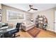 Comfortable bedroom features a built-in bookcase and a ceiling fan fixture at 5105 Chemin De Vie, Atlanta, GA 30342