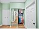 Bedroom closet featuring mirrors, hanging storage, and additional closet doors across the hall at 5105 Chemin De Vie, Atlanta, GA 30342